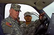 Lt. Gen. H Steven Blum, chief, National Guard Bureau, is briefed by a citizen-soldier near San Diego, Calif., on Nov. 27, 2006, during a visit to troops participating in Operation Jump Start. The soldier, who is not being identified for security reasons, explained how equipment in the vehicle enables troops to identify possible illegal aliens crossing the border and relay that information to Border Patrol agents. Up to 6,000 National Guard members are helping the Border Patrol secure the nation's southern border. U.S. Army photo by Sgt. Jim Greenhill