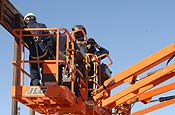 Unidentified workers construct a vehicle barrier that will secure the border between the United States and Mexico. The National Guard and US Customs and Border Protection Agency are working together to bolster security along the border. (USAF Photo/Master Sgt Gerold O. Gamble)