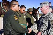 Lt. Gen. H Steven Blum, chief, National Guard Bureau, talks with Border Patrol agents during a visit to the U.S. border with Mexico near Columbus, N.M., on Nov. 29, 2006. Up to 6,000 National Guard troops are helping the Border Patrol secure the nation's southern border in Operation Jump Start. U.S. Army photo by Sgt. Jim Greenhill