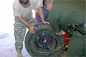  National Guard assigned to Hebbronville, TX assists in the removal of contraband from a tire and dismantling and unloading of marijuana from a gooseneck trailer.