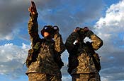 Members of the New York Army National Guard's 2nd Battalion, 108th Infantry, observe the Mexican border for illegal activity. The NYARNG is part of Operation Jump Start, assisting the Border Patrol in preventing and deterring illegal immigration.