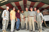 Starting second from left, Gov. Tim Pawlenty of Minnesota; Gov. Mike Rounds of South Dakota; Gov. Deval Patrick of Massachusetts; Gov. Jay Nixon of Missouri; Gov. Jim Douglas of Vermont; and Gen. Craig McKinley, chief of the National Guard Bureau, at Joint Base Balad, north of Baghdad, Iraq, during a trip in early August. The colonels at either end are not identified. (Courtesy photo)