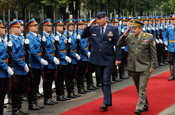 Air Force Gen. Craig McKinley, the chief of the National Guard Bureau, and Serbian Army Lt. Gen. Miloje Miletic, chief of staff of the Serbian Armed Forces, review Serbian troops following McKinley's arrival in Belgrade, Serbia, on Sept. 10, 2010. McKinley visited the country to get a first-hard look at National Guard State Partnership Program activities. (U.S. Army photo by Staff Sgt. Jim Greenhill)