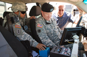 Army Maj. Gen. Peter M. Aylward, special assistant to the chief of the National Guard Bureau, right, learns about the equipment used by California National Guard members at inland and coastal sites in southern California to support U.S. Customs and Border Protection and U.S. Immigration and Customs Enforcement. Aylward visited National Guard troops along the U.S.-Mexico border in all four border states last week. (Photo by Army Staff Sgt. Jessica Inigo, California National Guard) 