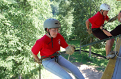 Two young adults attending the West Virginia National Guard's Youth Leaders Camp prepare to rappel off a 50-foot tower at Camp Dawson. The annual week-long camp provides an opportunity for high-school aged kids to challenge themselves through a variety of leadership and personal development scenarios. (Photo courtesy of the West Virginia National Guard)