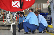 Romanian Air Force officers look over an F-16 Fighting Falcon fighter jet at the Alabama National Guard's 187th Fighter Wing during a recent visit as part of the National Guard State Partnership Program. (Courtesy photo) (Released) 