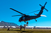 Members of the 106th Rescue Wing demonstrate the capabilities of an HH-60 Pave Hawk helicopter during a previous visit visit to South African in 2010. (New York State Division of Military and Naval Affairs courtesy photo) (Released)