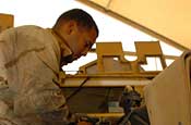  Spc. Geovany Soto, a light-wheeled vehicle mechanic with Headquarters and Headquarters Company, 130th Engineer Battalion, Puerto Rico National Guard, repairs an uparmored Humvee on Camp Liberty, Iraq, Wednesday, August 1, 2007. The 130th uses Humvees as well as other vehicle to clear routes of Improvied Explosive Devices in Iraq. (U.S. Army Photo by Sgt. S. Patrick McCollum) (Released)