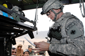 Sgt. 1st Class Aaron Christianson, Illinois Army National Guard’s Headquarters and Headquarters Sustainment Brigade, 2nd Battalion, 122nd Field Artillery based in Chicago, reviews and fills prescriptions at Kuchi Village during their medical assistance visit April 5. (Photo by G.A. Volb, Camp Alamo Public Affairs)