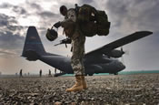 MAJ Lawendowski from the Alaskan National Guard, assembles a swing set for Iraqi children living in an impoverished nighborhood, during a joint patrole humanitarian aid mission, in the town of Al Hillah, Iraq on May 14 2005. (U.S. Army Photo by SGT Hamilton, Arthur)