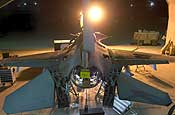 U.S. Air Force Master Sgt. Walter Markley performs an inspection on an F-16 Fighting Falcon aircraft at Balad Air Base, Iraq, May 22, 2006. DoD photo by Senior Airman Brian Ferguson, U.S. Air Force.