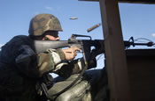 U.S. Air Force Tech. Sgt. Chris White, from the 142nd Civil Engineering Squadron, 142nd Fighter Wing, Oregon Air National Guard, simulates engaging an enemy suicide bomber with an M16A2 rifle at Portland Air National Guard Base in Portland, Ore., during an operational readiness inspection. June 17, 2006 (U.S. Air Force photo by Tech. Sgt. Erik D. Simmons)