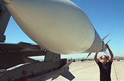 Getting ready for Red Flag - Staff Sgt. Jessica Srigley inspects an AIM-120 missile on an F-16 Fighting Falcon that is being readied for a mission at Red Flag 06-02 at Nellis Air Force Base, Nev., on Aug. 8. Sergeant Srigley is a maintainer with the Iowa Air National Guard's 132nd Fighter Wing in Des Moines. (U.S. Air Force photo/Tech. Sgt. Patrick M. Kuminecz)