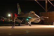U.S. Air Force Tech. Sgt. Mike Johanns marshals an F-16 Fighting Falcon aircraft on Nellis Air Force Base in Las Vegas, Nev., Aug 15, 2006, during exercise Red Flag 06-02. Johanns is a crew chief with 132nd Fighter Wing, Iowa Air National Guard. (U.S. Air Force photo by Tech. Sgt. Bob Sommer)