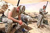 PANJWAYI, Afghanistan - Army Col. R. Stephen Williams, 207th Infantry Brigade commander, Alaska National Guard (left) and Army Maj. Robert Koch, chaplain (right), also with the 207th, gather for a religious service to bless Task Force Grizzly while conducting offensive operation in Panjwayi in support of Operation Medusa. (Photo by Army Sgt. Mayra Kennedy)