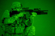 U.S. Army Sgt. Chris Walsh takes a position on top of the roof at an Iraqi police compound in Bayji, Iraq, Sept. 14, 2006. Walsh is from 1st Platoon, 2nd Battalion, 300th Field Artillery Regiment, Wyoming National Guard Police Training Team. (U.S. Army photo by Spc. Billy Brothers)