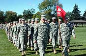 Capt. Jacob Roy leads the Vermont Army National Guard's 131st Engineer Company onto the Fort McCoy, Wis., parade field during a deployment ceremony Sept. 23, 2006. The 131st includes Soldiers from Vermont and Indiana, and is attached to the Arkansas Army National Guard's 875th Engineer Battalion, which departed Arkansas July 22. The unit has finished a grueling two-month training regiment at Fort McCoy and will depart shortly on a year-long deployment in support of Operation Iraqi Freedom. (U.S. Army photo by Staff Sgt. Chris A. Durney, 875th Engineer Battalion Public Affairs)