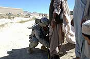  A U.S. Army Soldier from the 102nd Infantry Regiment, Connecticut National Guard uses a portable metal detection device on a local villager before he is seen at a medical and veterinarian civic action program by the Cooperative Medical Assistance team out of Bagram Airfield Oct. 5, 2006, in Kharwar, Afghanistan. (U.S. Army photo by Sgt. Joey L. Suggs)