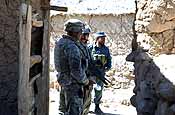 U.S. Army Soldiers from 102nd Infantry Regiment, Connecticut National Guard secure a passageway during a medical and veterinarian civic action program in Charkh, Afghanistan, Oct. 6, 2006. (U.S. Army photo by Sgt. Joey L. Suggs)