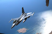 A New York Air National Guard F-16 Fighting Falcon peels off after receiving fuel from a KC-10 Extender Oct. 17 over Southwest Asia. Aircraft from the 908th Expeditionary Air Refueling Squadron, including the KC-10 and KC-135 Stratotanker, provide fuel for coalition aircraft missions for Operations Iraqi Freedom and Enduring Freedom. The squadron is attached to the 380th Air Expeditionary Wing, the largest air refueling wing in Southwest Asia. (U.S. Air Force photo/Senior Airman Matt Craig)