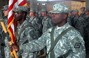  Soldiers of the Arkansas Army National Guard's 875th Engineer Battalion and the Missouri Army National Guard's 110th Engineer Battalion stand together during a transfer of authority for a critical route clearance mission in Iraq Nov. 1, 2006. The 110th is wrapping up a yearlong deployment as the 875th takes the reins. (U.S. Army photo by Staff Sgt. Chris A. Durney, 875th Engineer Battalion Public Affairs)