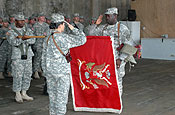  Lt. Col. Patricia Anslow, commander of the Arkansas Army National Guard's 875th Engineer Battalion, and Command Sgt. Maj. Billy Ward proudly uncase the unit colors at a formal transfer of authority ceremony at Camp Striker, Iraq, Nov. 1, 2006. The 875th took over from the Missouri Army National Guard's 110th Engineer Battalion, which is completing a yearlong deployment in support of Operation Iraqi Freedom. (U.S. Army photo by Staff Sgt. Chris A. Durney, 875th Engineer Battalion Public Affairs)