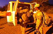 Soldiers assigned to E Company, 629th Military Intelligence Battalion, Maryland Army National Guard, patrol an area near the Joint Task Force Guantanamo detention center at Naval Base Guantanamo Bay, Nov. 17. The company's main missions as part of the task force include external perimeter security as well as acting as a quick reaction force should something happen inside the detention center. (photo by Staff Sgt. Jon Soucy, National Guard Bureau)