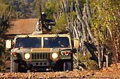 Soldiers assigned to E Company, 629th Military Intelligence Battalion, Maryland Army National Guard, patrol an area near the Joint Task Force Guantanamo detention center at Naval Base Guantanamo Bay, Nov. 17. The company's main missions as part of the task force include external perimeter security as well as acting as a quick reaction force should something happen inside the detention center. (photo by Staff Sgt. Jon Soucy, National Guard Bureau)