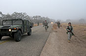 U.S. Army Soldiers from 1st Battalion, 143rd Field Artillery Regiment (California National Guard) conduct an early morning tactical road march at Camp Roberts, Calif., Nov. 18, 2006. (U.S. Army photo by Maj. Daniel Markert) 