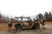 Exercise Granite Triangle - Pfc. David Burris, left, and Pfc. Kimberly Poole, both assigned to the 237th Military Police Company, move from cover while assaulting an objective as a team during Exercise Granite Triangle at Fort Pickett, Va.