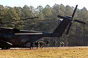 Exercise Granite Triangle - Soldiers from C Company, 3rd Battalion, 172nd Infantry Regiment (Mountain) rush for the woodline after exiting a U.S. Navy MH-53E Sea Dragon during Exercise Granite Triangle at Fort Pickett, Va.