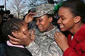 Sgt. 1st Class Keron Johnson (center), 250th Personnel Services Detachment, New Jersey Army National Guard, with daughters Sapphira (left), age 12, left and Mikayla (right), age 15. The 250th, along with the 50th Personnel Services Battalion returned to New Jersey from a year-long deployment in Afghanistan in support of Operation Enduring Freedom. (Photo by Tech. Sgt. Mark Olsen, NJDMAVA/PA)