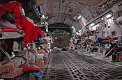 AIR GUARD HOSPITAL: Wounded, injured and sick patients rest on litters in the cargo bay of a C-17 Globemaster III during a March 4 flight from Balad Air Base in Iraq to Ramstein Air Base in Germany.