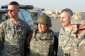 CAMP ADDER, Iraq (From left) Lt. Col. John Burk, garrison commander, 258th Rear Area Operations Center; Arizona Gov. Janet Napolitano; Command Sgt. Maj. Kevin Herzinger, 258th RAOC; and Lt. Gen. H. Steven Blum, chief of the National Guard Bureau, stand together for a photo March 7 at the flight line before Napolitano's departure.