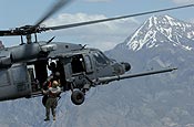 A Utah Army National Guard soldier from the 19th Special Forces is hoisted up to an HH-60 Pave Hawk helicopter during a combat search and rescue integration exercise over the Utah Test and Training Range in Sandy, Utah, on May 3, 2007.