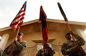 Soldiers from the 58th Infantry Brigade Combat Team and the 38th Division Support Command stand at attention as part of the color guard during the transfer of authority ceremony in which the 58th IBCT assumed responsibility for garrison operations of Victory Base Complex, Iraq, from the 38th DISCOM, Tuesday, July 10, 2007. The 58th IBCT will be responsible for all daily operations on VBC. (U.S. Army photo by Staff Sgt. Jon Soucy)