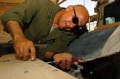  Staff Sergeant Pedro Molina, a light wheel vehicle mechanic with Headquarters and Headquarters Company, 130th Engineer Battalion, Puerto Rico National Guard, repairs an uparmored Humvee on Camp Liberty, Iraq, Wednesday, August 1, 2007. The mechanics of the 130th rapidly repair vehicles such as Humvees, resulting in a 98 percent combat readiness rate for the Battalion's vehicles. (U.S. Army Photo by Sgt. S. Patrick McCollum) (Released)