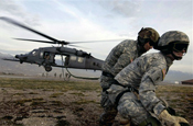  Soldiers from the Utah National Guard retrieve a fast rope after being dropped into a landing zone Nov. 9, 2007, during a combat search and rescue exercise at Camp Williams, Utah. U.S. Air Force photo by Master Sgt. Kevin J. Gruenwald.