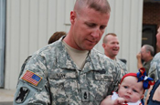 CARVILLE, La. – A 769th Engineer Battalion Soldier is reunited with his daughter at the Baton Rouge Metropolitan Airport on Mon., July 14 after a year-long deployment in support of Operation Iraqi Freedom. (U.S. Army Photo by Staff Sgt. Lacy Brown, 415th Military Intelligence Battalion Unit Public Affairs Representative) 