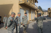Assistant Adjutant General of the Indiana National Guard Brig. Gen. Omer C. Tooley points out the advantages of a “marketplace” training area at Muscatatuck Urban Training Center in Butlerville, Ind. to Gen. Peter W. Chiarelli, Vice Chief of Staff of the U.S. Army. The Adjutant General of the state of Indiana, Maj. Gen. R. Martin Umbarger, looks on. (U.S. Army photo by Sgt. Brad Staggs)