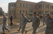Vice Chief of Staff of the U.S. Army Gen. Peter W. Chiarelli tours Muscatatuck Urban Training Center in Butlerville, Ind. during a visit on Jan. 23. Gen. Chiarelli was accompanied by The Adjutant General of the state of Indiana, Maj. Gen. R. Martin Umbarger, Assistant Adjutant General Brig. Gen. Omer C. Tooley and Muscatatuck Site Manager Lt. Col. Chris Kelsey. (Photo by Sgt. Brad Staggs)