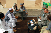 Provincial Reconstruction Team members (right) meet with local province official to address concerns regarding a Commanders Emergence Relief Program. The Provincial Reconstruction Team is trying to reach an agreement between the South Administrator and the Governor that will allow work to continue, during a training exercise at Camp Atterbury. (U.S. Army photo by Sgt. William Hill)