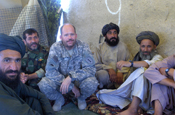 Capt. Phillip Chik, of the Oregon Army National Guard, meets with Afghani tribal leaders in the Helmand Province in Afghanistan in July 2008. Members of Chik's unit helped train Afghan National Army members during Operation Enduring Freedom (Photo courtesy of Oregon Army National Guard)