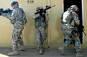 CAMP BUERHRING, Kuwait - Soldiers with 2nd Battalion, 107th Cavalry Regiment, Ohio National Guard, enter a room during MOUT training. (Sgt. Chris Jones, 40th Public Affairs Detachment)