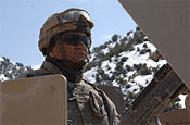 Spc. Victor Piacente of 1st Battalion, 102nd Infantry Regiment of the Connecticut National Guard, and part of the Gardez Provincial Reconstruction Team, scans his sector while his convoy stops for a break on an extended patrol in the Gardez Province of Afghanistan. (U.S. Army photo by Staff Sgt. Michael Bracken.)