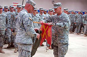 Soldiers of the Wyoming Army National Guard's 2nd Battalion, 300th Field Artillery Regiment, attached to the 25th Infantry Division's 3rd Infantry Brigade Combat Team, cased their regimental colors symbolizing mission completion during a transfer of authority ceremony at Forward Operating Base Warrior, Kirkuk, Iraq, March 19. (Photo by Spc. Michael Alberts)
