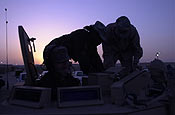 CAMP BUEHRING, Kuwait – Sgt. James Kobelski, Montville, Conn. Spc. Lasonya Jones, Stratford Conn. and Spc. Michael Horrigan, Branford, Conn., all transporters assigned to the Connecticut National Guards' 1048th Transportation Company, perform pre-combat checks of their Armored Security Vehicle at Camp Buehring