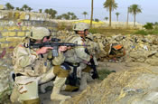  Soldiers from the 940th MP Company out of Walton Kentucky, conduct a joint patrole, in the town of Al Hillah, Iraq on May 14 2005. (U.S. Army Photo by SGT Hamilton, Arthur)