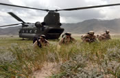 Soldiers from Alpha Company, 3rd Battalion, 141st Infantry Regiment, Texas Army National Guard, pull security during a Quick Reaction Force exercise at East River Range near Bagram, Afghanistan on June 10, 2005. (US Army photo by SPC Harold Fields)