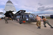 Soldiers from 1022nd Medical Company (AA) Wyoming Army National Guard, help guide the units UH-60 Blackhawk into an Antanov AN-124 at Buckley Air Force Base, Denver, Colorado, that was contracted to take the helicopters to Egypt where the unit will provide medical evacuation support to Operation Bright Star. Released (Photo by Sgt. Kevin S. Abel)